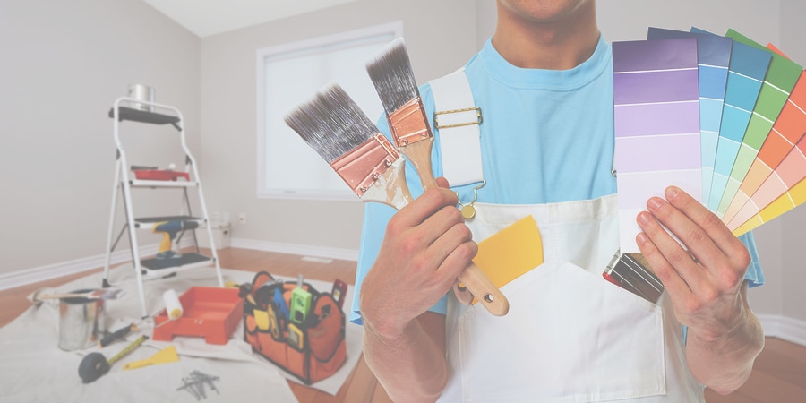 Painter hand with painting brush